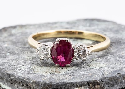 Lot 31 - A 20th Century ruby and diamond three stone ring