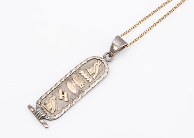 Lot 35 - An Egyptian gold and silver pendant