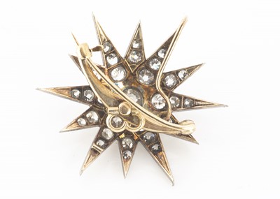 Lot 72 - An early 20th Century twelve pointed diamond set star brooch or pendant