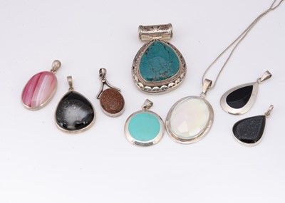 Lot 88 - A collection of hardstone silver framed pendants