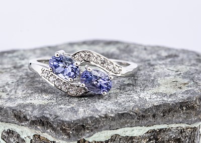 Lot 95 - A white gold tanzanite and zircon dress ring