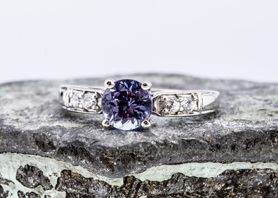 Lot 97 - A 9ct white gold tanzanite and zircon dress ring