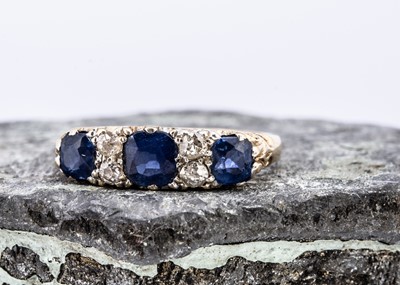 Lot 99 - An 18ct gold sapphire and diamond dress ring