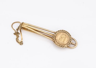 Lot 117 - A Venezuelan gold coin mounted as a tie slide in 18ct gold