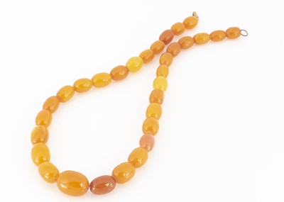 Lot 80 - A string of amber graduated butterscotch beads