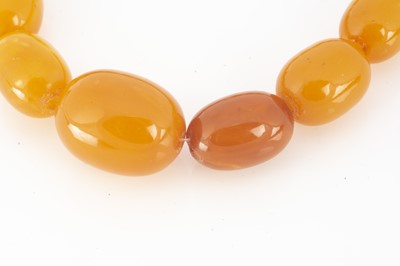 Lot 80 - A string of amber graduated butterscotch beads