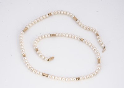 Lot 165 - A long fresh water cultured pearl necklace with gilt metal spacers