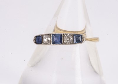 Lot 180 - An Art Deco five stone diamond and sapphire dress ring