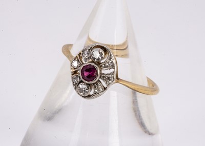 Lot 181 - An Art Deco oval ruby and diamond dress ring