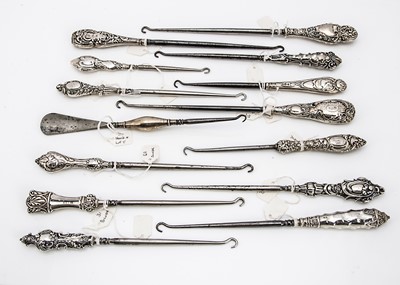 Lot 196 - A collection of Victorian and later silver handled button hooks