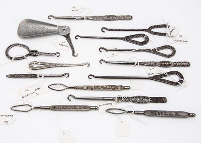 Lot 207 - Fourteen Victorian and later Advertising and Retailers metal button hooks and shoe horns