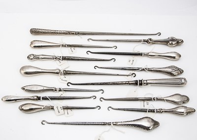 Lot 209 - A collection of fourteen Victorian and later silver handled button hooks