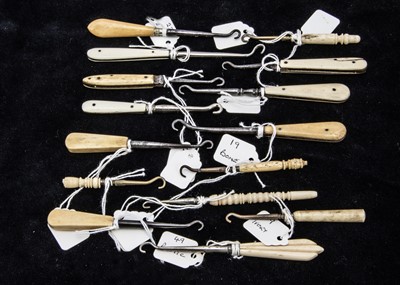 Lot 210 - A collection of fifteen Victorian and later bone handled button hooks