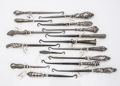 Lot 214 - A collection of Victorian and later silver handled button hooks