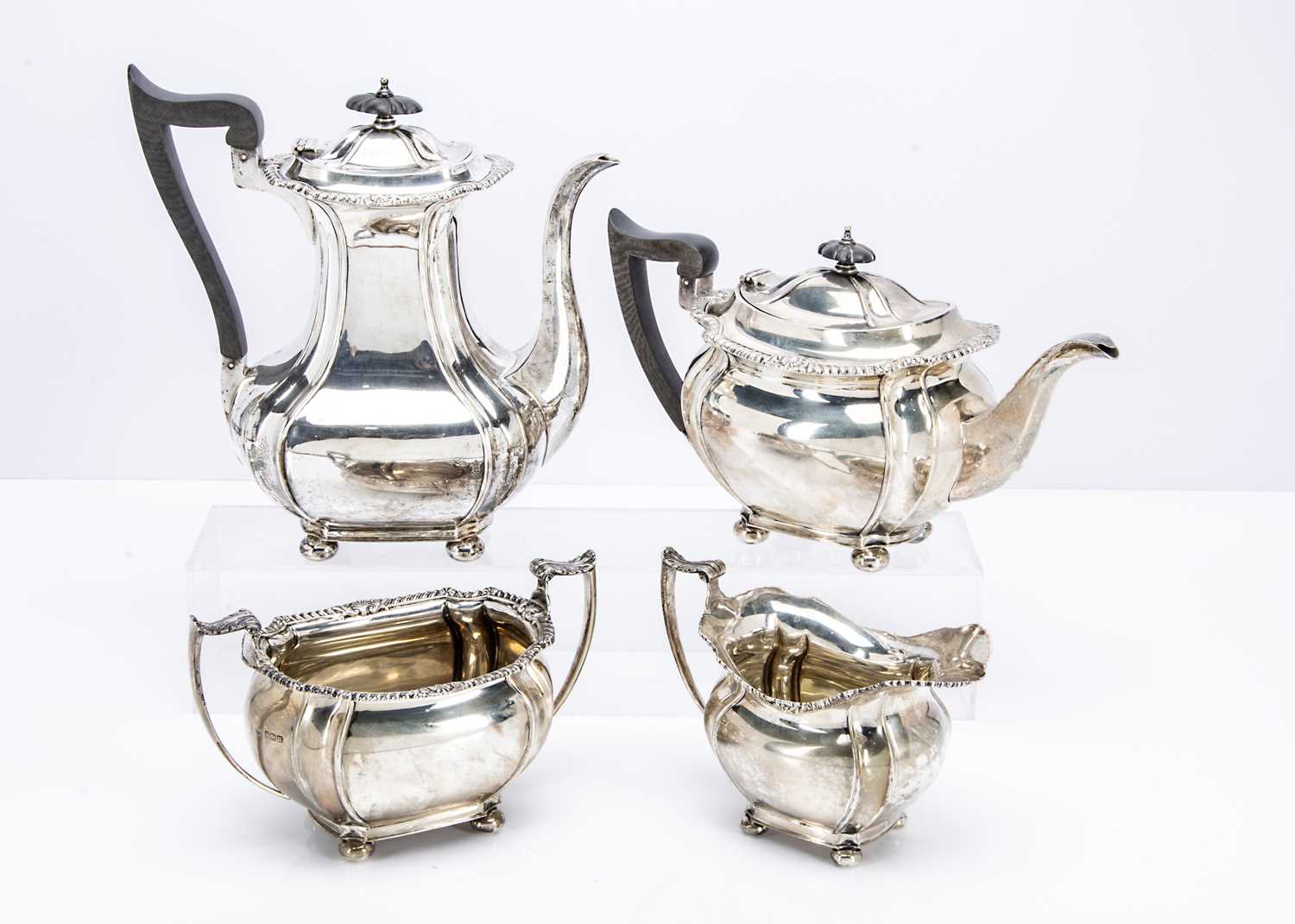 232 - An Edwardian silver four piece tea set by John Round & Son,