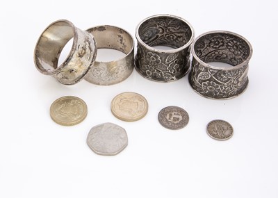 Lot 263 - Four silver napkin rings and a collection of modern coins