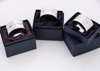 Lot 264 - Three modern silver napkin rings by LJM