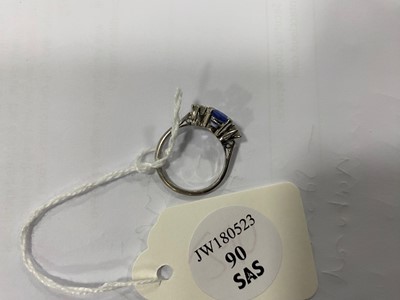 Lot 90 - An 18ct white gold sapphire and diamond three stone ring