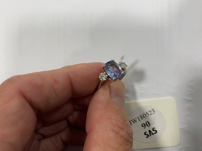 Lot 90 - An 18ct white gold sapphire and diamond three stone ring