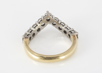 Lot 334 - An 18ct gold diamond set wishbone half eternity ring