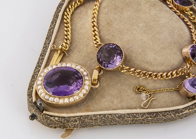 Lot 342 - An Edwardian 15ct marked amethyst and seed pearl necklace and pendant