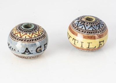 Lot 356 - A pair of Italian pottery  Deruta 'Fuseruola' spindle weight beads