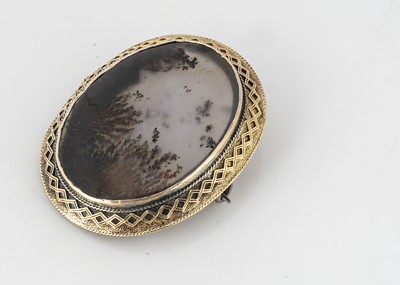 Lot 327 - A 19th Century moss agate oval brooch