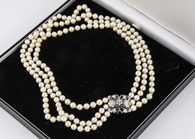 Lot 328 - A three strand cultured pearl necklace
