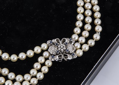 Lot 328 - A three strand cultured pearl necklace