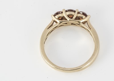 Lot 330 - A three stone diamond dress ring