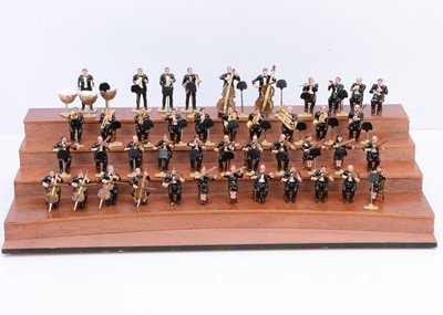 Lot 569 - 43pce Orchestra in Evening dress with a tiered wooden stage