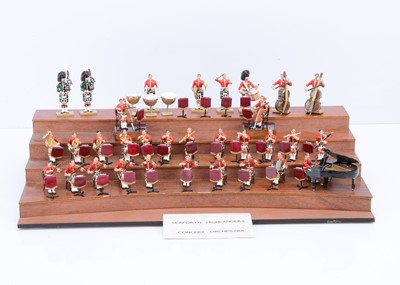 Lot 570 - 32 pce Seaforth Highlanders Concert Orchestra with a tiered wooden stage