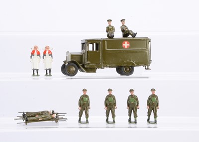 Lot 583 - Britains square nose Army Ambulance with post WW2 Medical personnel comprising tin-hatted stretcher bearers (4)