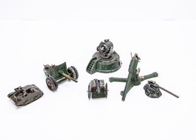 Lot 585 - Guns and vehicles by various makers including Britains and Astra with some figures by Taylor & Barrett amongst others comprising Astra searchlight