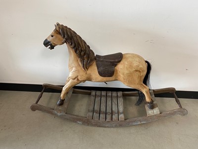 Lot 373 - A c1970s carved wooden rocking horse