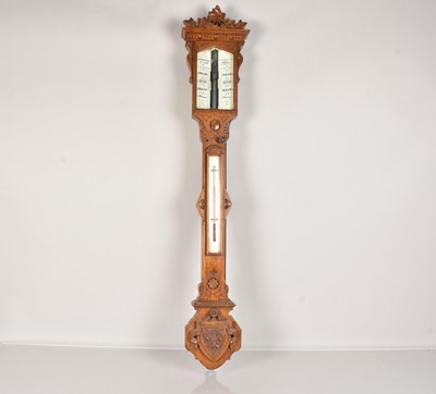 Lot 243 - A vintage Stick Barometer by H.Hughes & Son