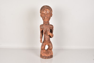 Lot 297 - An African carved wooden figure