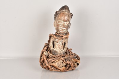 Lot 305 - A carved African Fetish Figure