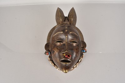 Lot 317 - A cast metal mask of a female