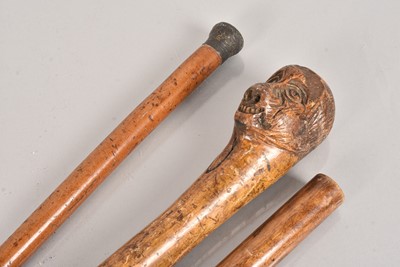 Lot 378 - A carved walking cane