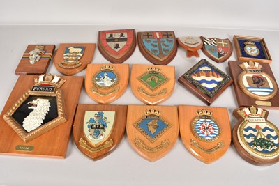 Lot 614 - An assortment of wooden and cast wall plaques