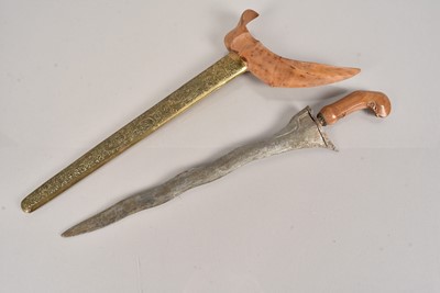 Lot 849 - A Middle Eastern Kris knife