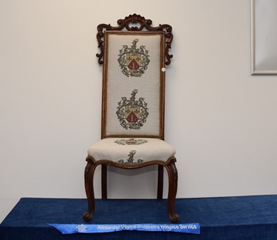 Lot 15 - A Victorian and later carved walnut single hall chair with nice modern family crest upholstery