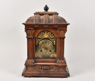 Lot 63 - An Edwardian oak mantle clock