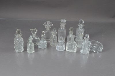 Lot 112 - A collection of cut and moulded glass scent bottles