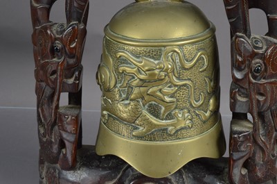Lot 156 - A Chinese brass bell or gong with a dragon chasing a flaming pearl