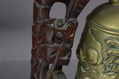 Lot 156 - A Chinese brass bell or gong with a dragon chasing a flaming pearl