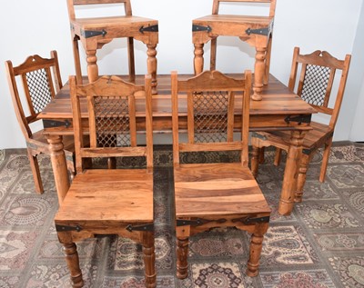 Lot 170 - A modern mango wood and iron dining table and six chairs