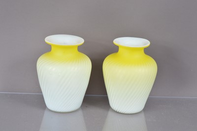 Lot 229 - A pair of Victorian canary yellow and white satin glass "Pompeian Swirl" air trap vases