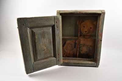 Lot 273 - An interesting wooden painted cabinet opening to reveal painted Teddy Bears behind iron bars